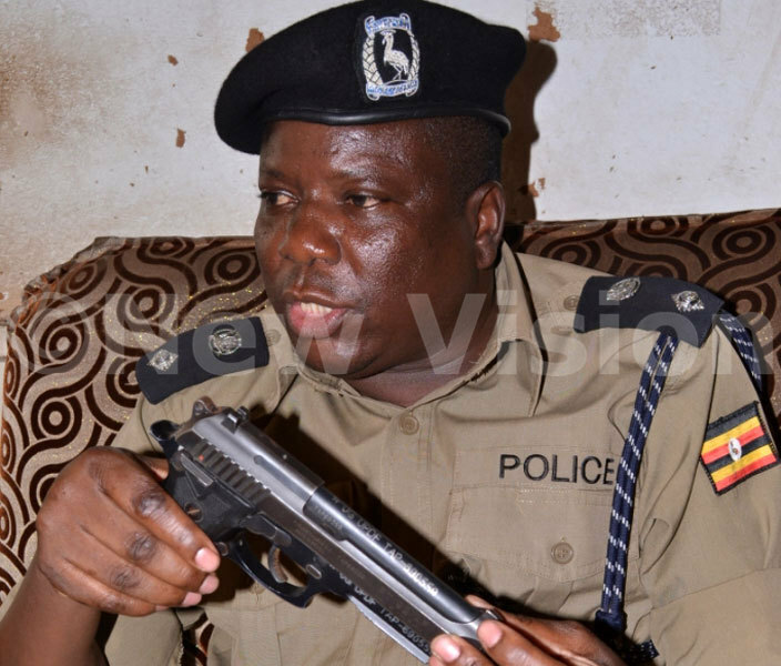 he ampala etropolitan olice spokesperson atrick nyango with the recovered pistol