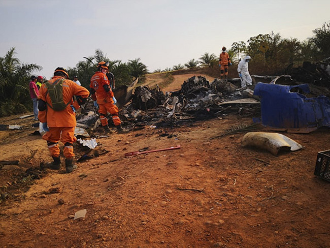 hoto released by olombias ivil efense press service showing members of civil defense at the site of a plane 3 crash  hoto