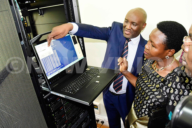  inistry of ducation  pecialist oniface ugisha explains to tate inister of ducation  osemary eninde about the ntegrated nspection ystem server in ampala on anuary 24 2019 ccording to the ministry the system has been piloted in over 1000 schools in 46 districts to help in inspection of schools hoto by enendy ryema