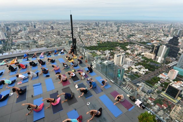 Asia Album: Practicing yoga on rooftop of skyscraper in Bangkok