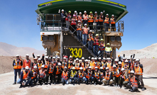 The retrofitted Komatsu trucks and team at Caserones