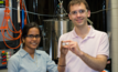 Sulata Sahu and Brian Chmielowiec hold a sample of nearly pure copper deposited on an iron electrode