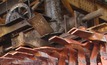 A worker handles copper plates at a Gecamines operation. Photo: Gecamines