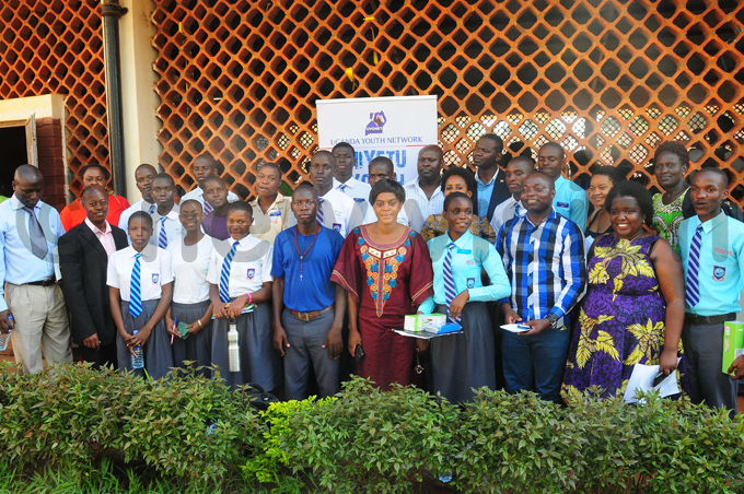 tudents teachers and  officials pose for a group photo after the debate hoto by icholas neal