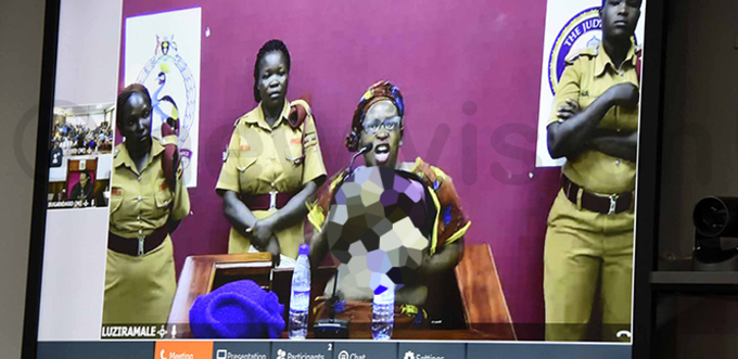  r tella yanzi removes her top in protest after she was sentenced via video link  ile photo
