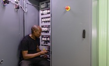 Chris Ngobeni, winding assistant at Marthinusen & Coutts, performing final checks on the generator rotor panel