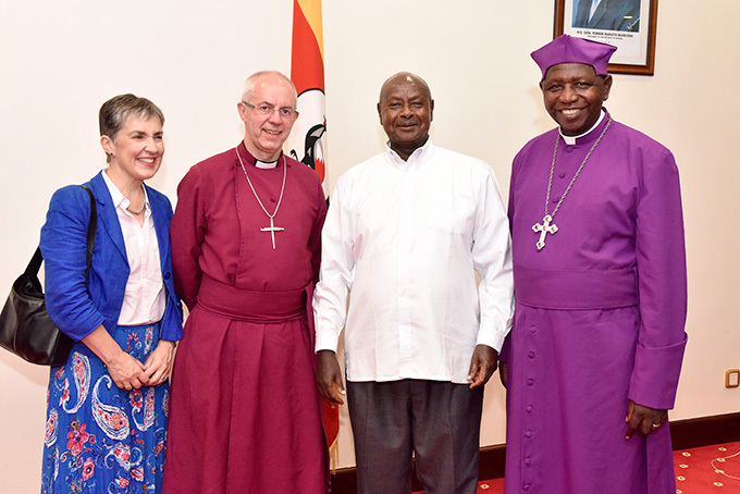  resident useveni poses for a photo with the rchbishop of anterbury ev ustin elbey his wife aroline elbey and the rchbishop of the hurch of ganda the ost ev tanley tagali at tate ouse ntebbe 