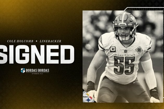 Holcomb signed to three-year contract