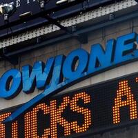 Dow slips more than 300 points Wednesday, broader markets end flat