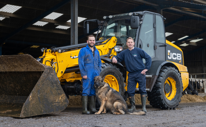 Marcus (Left) and Neil Rowland, pictured with George, and the long-serving JCB TM320S. 