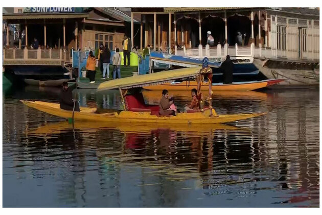 J-K: Early summer tourists enjoy chilly morning at Dal Lake in Srinagar