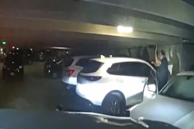 Bodycam shows a man barricaded in parking garage pointing gun at Dallas SWAT officers