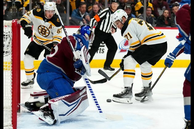 Avalanche rally past Bruins in OT for 17 straight home win