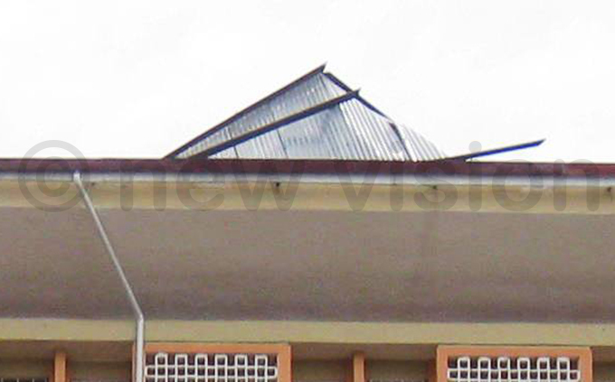  closeup of the damage to the roof of the building hoto by imon sekidde