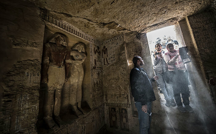  uests enter a newlydiscovered tomb at the aqqara necropolis 30 kilometres south of the gyptian capital airo on ecember 15 2018 belonging to the high priest ahtye who served during the fifth dynasty reign of ing eferirkare between 25002300  hoto by haled    