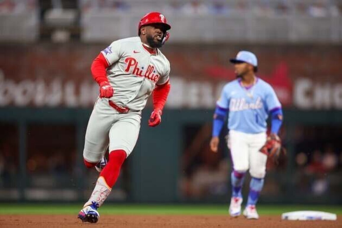 Phillies snap 10-game skid with extra-inning defeat of Braves