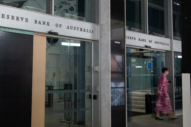 Australian central bank cuts interest rates for 1st time in over 4 years