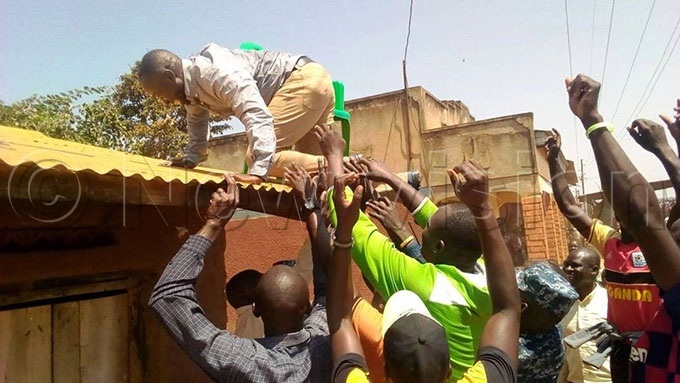  ew  minister being carried down after greeting his voters 