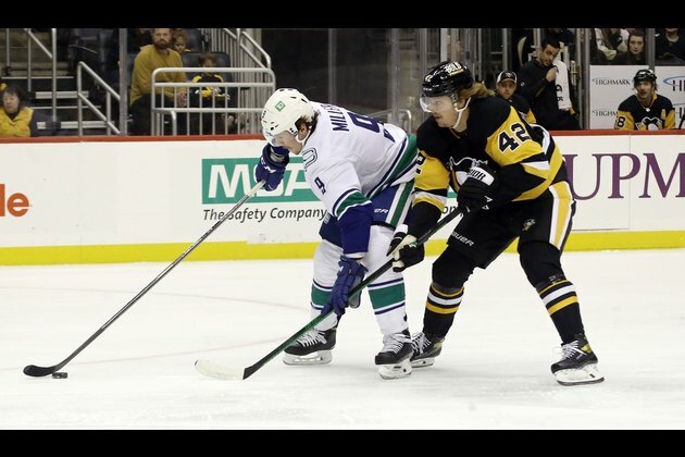 Penguins rout Canucks for fourth win in row