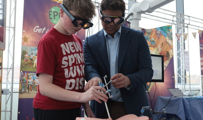 Mr Vinay Jasani, consultant spinal surgeon and Dylan Jaxon try out the new VR technology at the Royal Stoke University Hospital Name © University Hospitals of North Midlands NHS Trust Mr Vinay Jasani, consultant spinal surgeon and Dylan Jaxon try out the new VR technology at the Royal Stoke University Hospital Name © University Hospitals of North Midlands NHS Trust