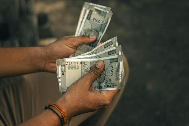 Indian rupee hits record low as weak flows, trade gap fuel slide