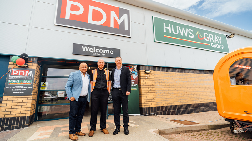 Daksh Gupta (CEO, Huws Gray Group), Neal Allan (Branch Manager), and Eddie Hernon (MD, PDM)