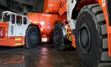 A Toro LH621i loader loading a Toro TH663i truck.