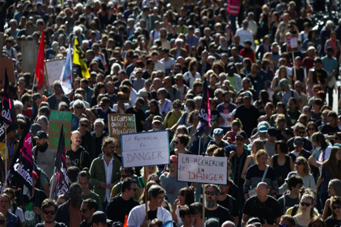 Thousands protest in France against Macron's austerity policies