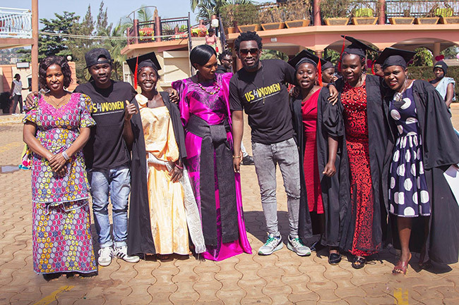  evixone and rinity pose with the women after their graduation through the 4 programme