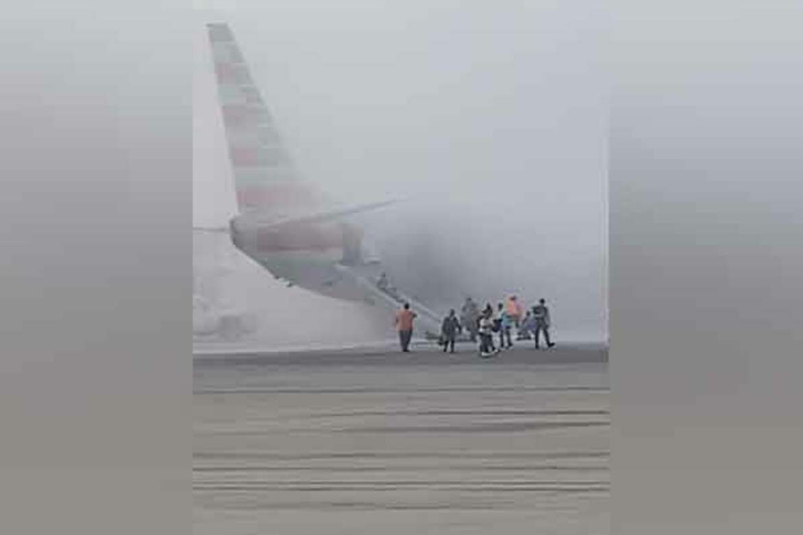 Passengers evacuated as American Airlines plane catches fire in Denver