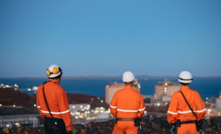 Workers observing an LNG infrastructure at Woodside's Pluto LNG facilitiy in Western Australia.