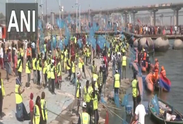 Sanitation workers at Maha Kumbh Mela clean ghats of Triveni Sangam