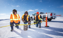 Opening the Nechalacho ice road are Vital's David Connelly (left) and Ray Anguelov (right), flanking Yellowknife Dene First Nation chief Ernest Betsina.