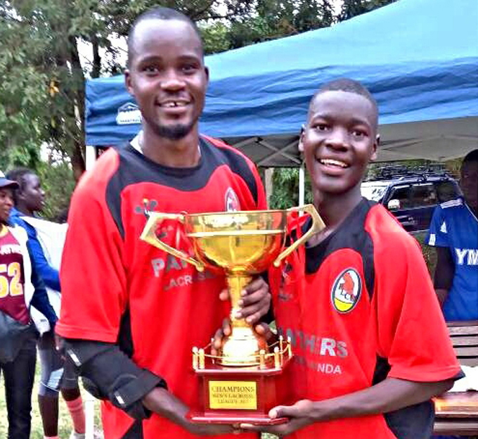 anthers iberty wesiime  and eagan chan celebrate with the league trophy
