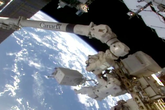 NASA Astronauts Conduct Space Walk Outside Space Station