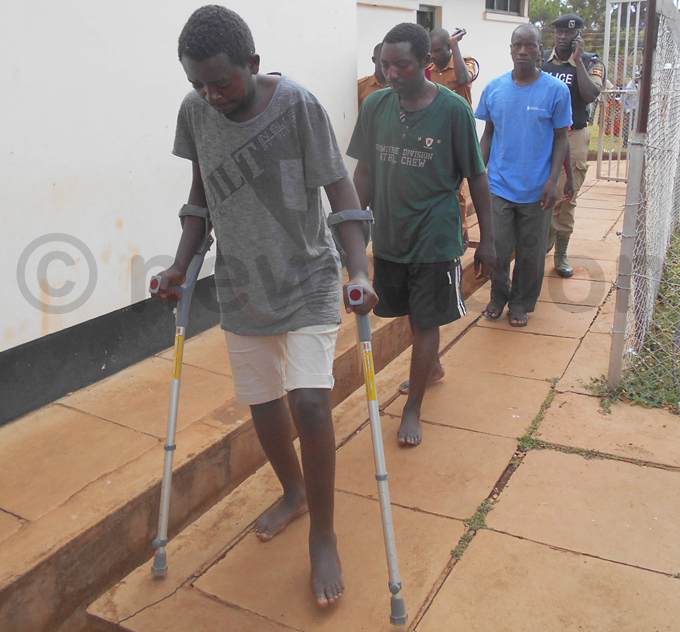 ne of the suspects arrived at court on crutches