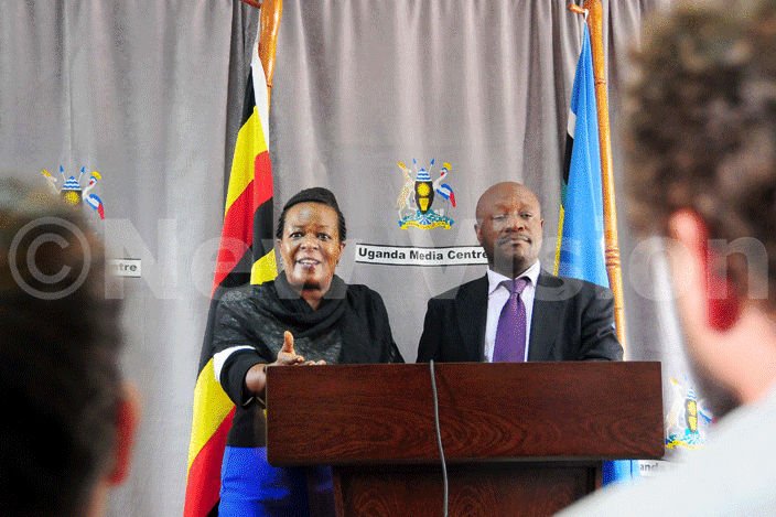  ast frican egislative ssembly members ora yamukama and ike sebalu addressing the media during a press rief at the media center