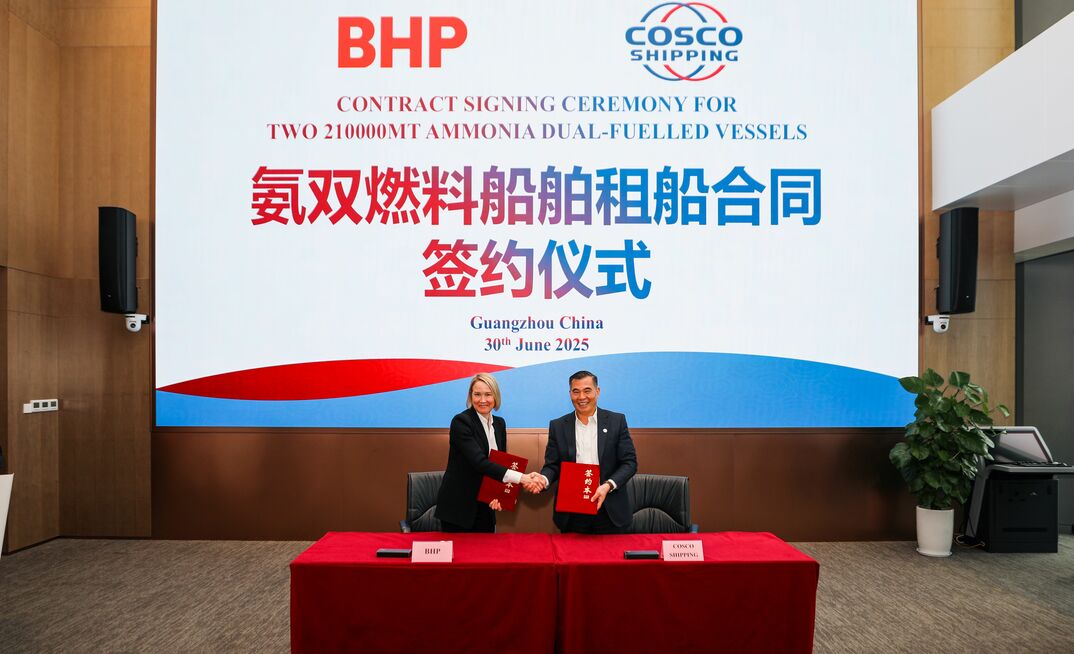 Emma Roberts (left) and Li Jin at the charter contract signing.