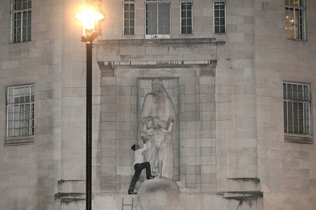 man climb BBC to attack statue by controversial artist