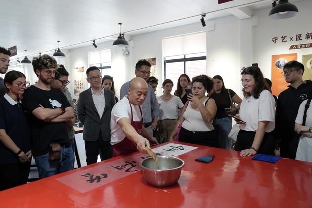 A Chinese cultural guardian holds heritage in his hands
