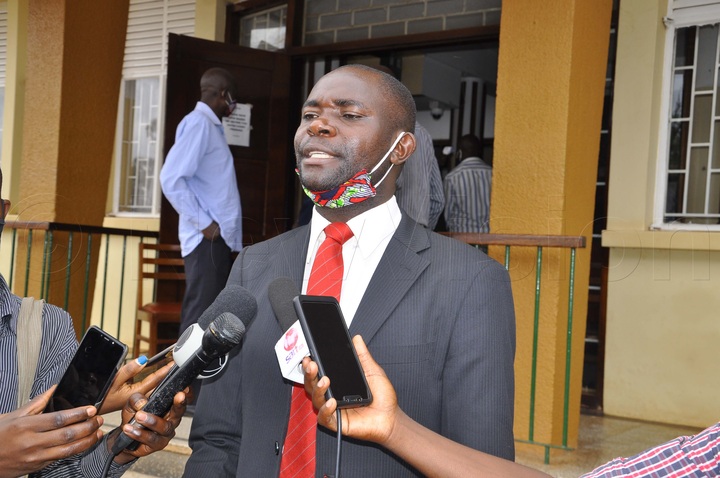 Mabirizi speaking to journalists outside court 