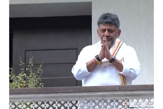 DK Shivakumar greets supporters gathered outside his Bengaluru residence ahead of oath-taking as Karnataka CM
