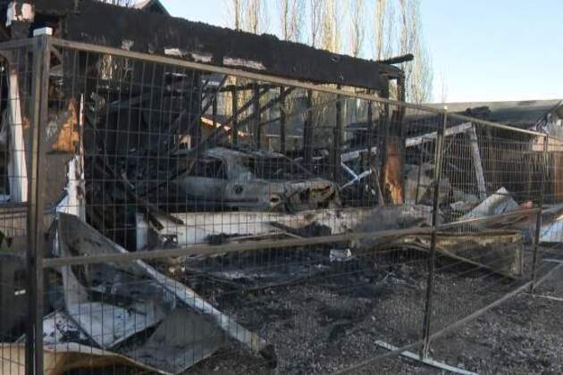 Several garages destroyed, homes damaged by overnight fire in southwest Calgary