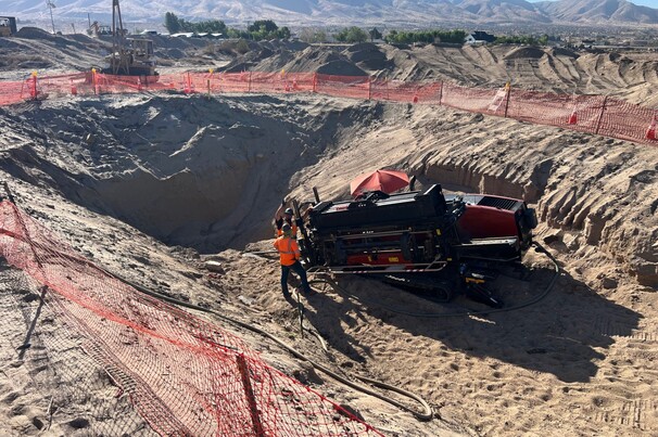 A 10ft by 10ft entry pit with a 2% grade down was dug to allow an 8in bore to be pulled 20ft under a bridge over Deep Creek