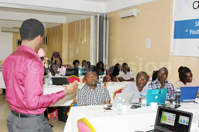  udges look on as one of the competitors pitches his idea hotos by enis subuga