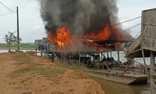  Colombia's security forces burn an illegal gold dredge in Bajo Cauca, Antioquia