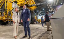 Denise Johnson (left) and Ragnar Udd with a Cat 798 fitted with the Dynamic Energy Transfer system. A mock-up of the electric rail is to their left. Credit: BHP