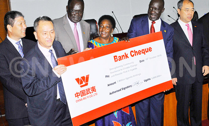 Chinese raise sh80m for Bududa landslide survivors Chinese raise sh80m for Bududa landslide survivors