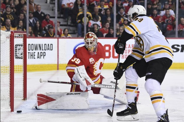 After slow start, Bruins rally past Flames