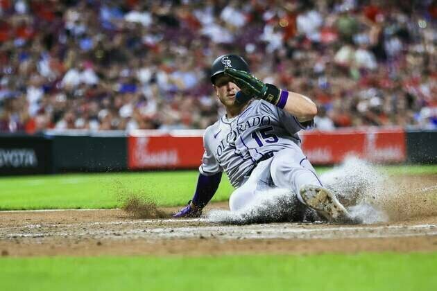 Rockies edge Reds in series opener thanks to wild pitch